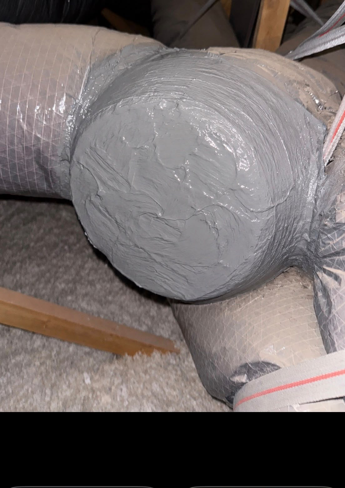 Air duct joint fully sealed with mastic after PureFlow duct sealing